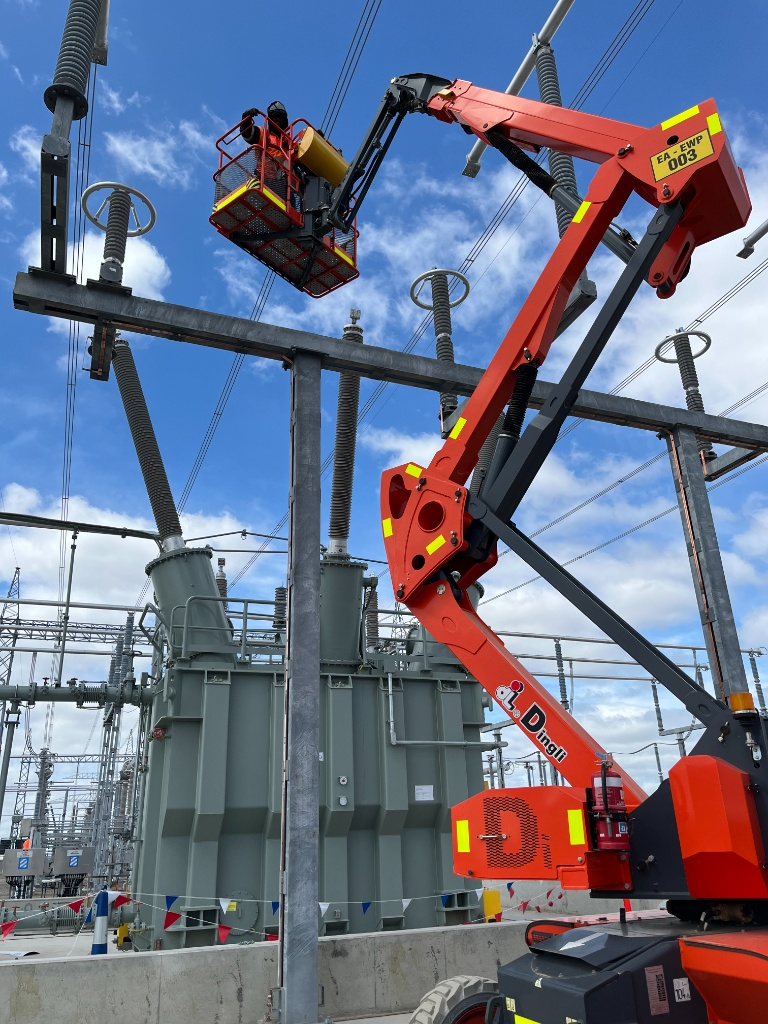 Mega Power Services electricians working from an elevated work platform at a Sydney high-voltage substation